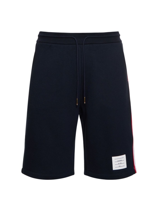 Thom Browne: Shorts de felpa de algodón con parche con logo - Azul Marino - men_0 | Luisa Via Roma