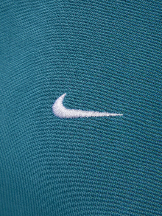 Nike: Sweat zippé en coton mélangé à capuche Solo Swoosh - Noise Aqua/White - men_1 | Luisa Via Roma