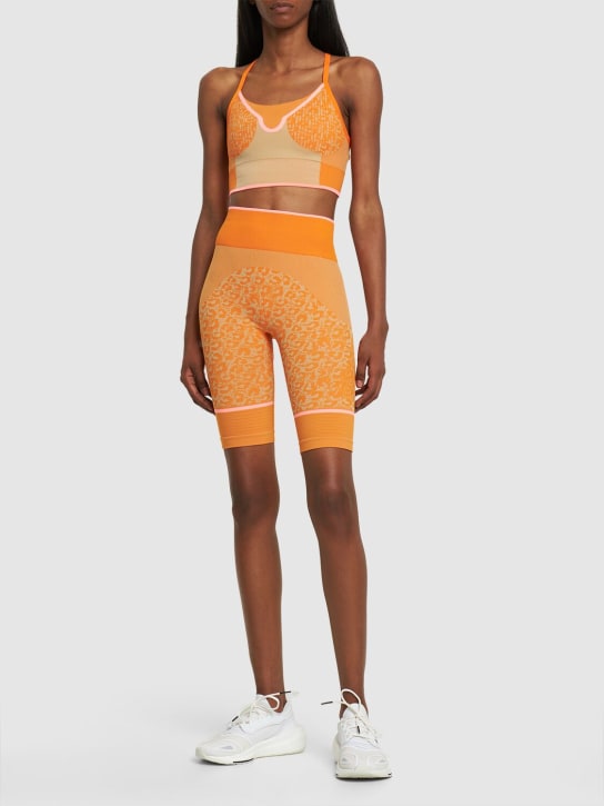 adidas By Stella McCartney: True Strength recycled tech bike shorts - Orange - women_1 | Luisa Via Roma