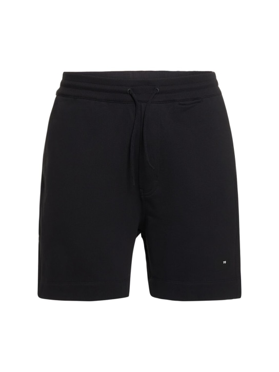 Y-3: Shorts in felpa di cotone con logo - men_0 | Luisa Via Roma