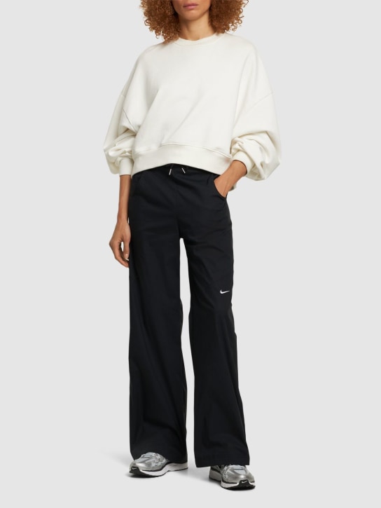 Nike: Pantalon taille haute en coton mélangé tissé - Noir - women_1 | Luisa Via Roma
