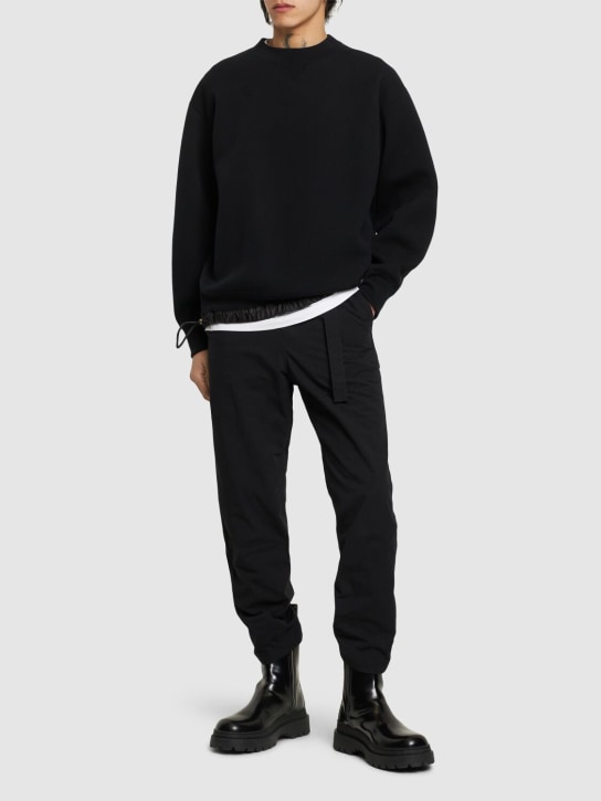 Sacai: Ripstop cotton & nylon pants - Black - men_1 | Luisa Via Roma