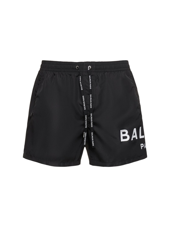 Balmain: Shorts mare in techno con logo - Nero/Bianco - men_0 | Luisa Via Roma