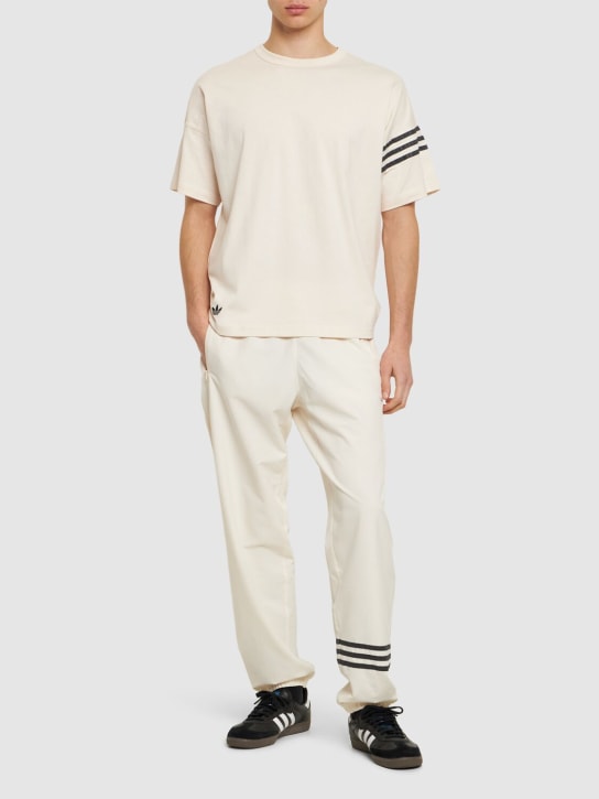 adidas Originals: Neuclassic stretch tech track pants - White - men_1 | Luisa Via Roma