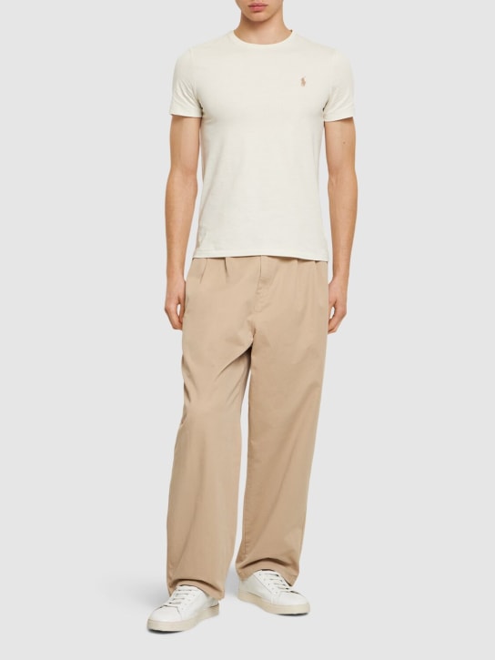 Polo Ralph Lauren: T-shirt in cotone distressed con logo - Parchment Cream - men_1 | Luisa Via Roma