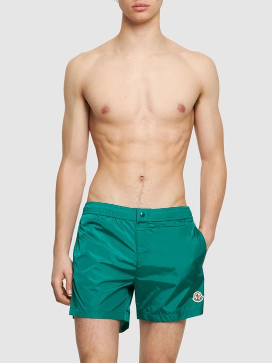 Moncler: Shorts mare in nylon con logo - Smeraldo - men_1 | Luisa Via Roma