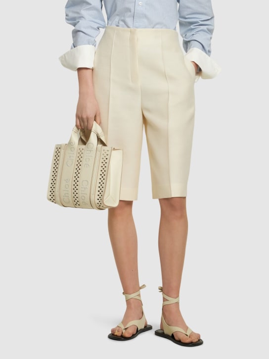 Chloé: Woody perforated grained leather bag - White - women_1 | Luisa Via Roma