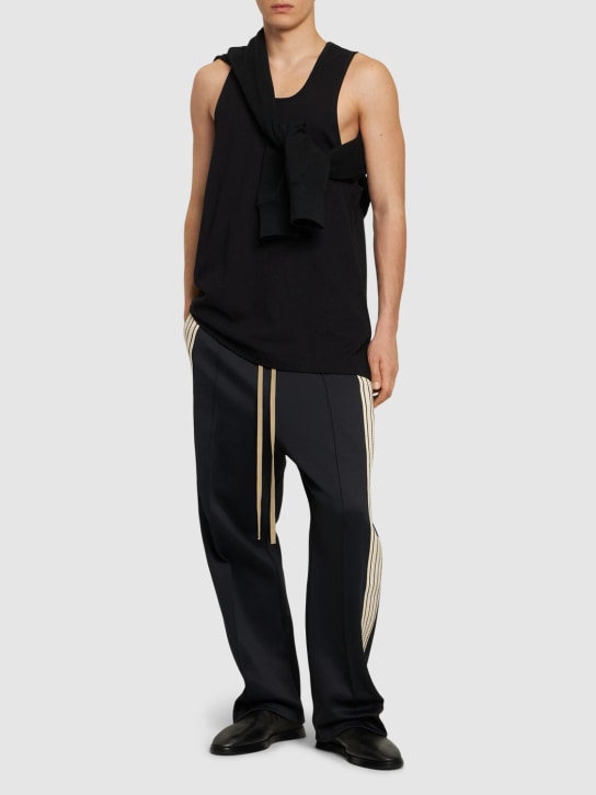Fear of God: Relaxed pintuck sweatpants w/ side bands - Black - men_1 | Luisa Via Roma