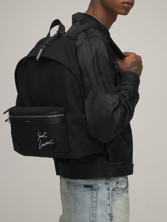 Saint Laurent: Embroidered detail canvas backpack - Black - men_1 | Luisa Via Roma
