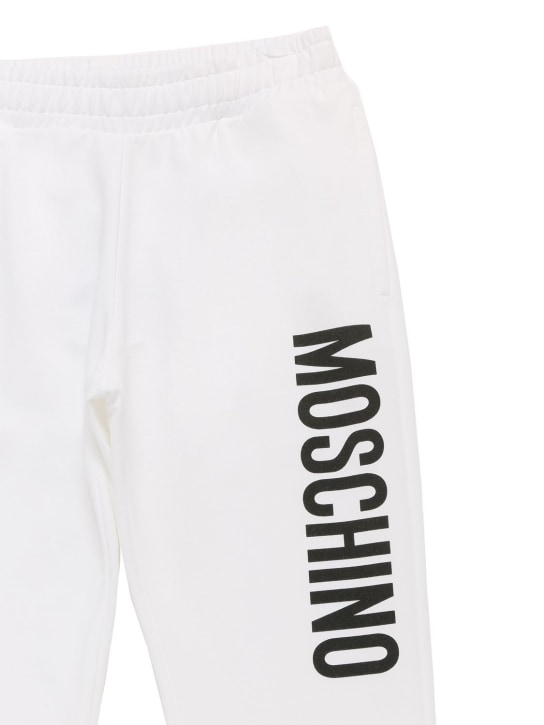 Moschino: Logo print cotton sweatpants - White - kids-boys_1 | Luisa Via Roma