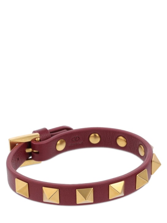 Valentino Garavani: Rockstud leather belt bracelet - Ruby/Gold - men_1 | Luisa Via Roma