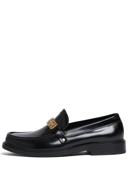 Moschino: Metal logo leather loafers - Black/Gold - men_0 | Luisa Via Roma