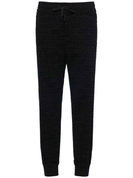 Dolce&Gabbana: Pantaloni in jersey di cotone con logo floccato - Nero - men_0 | Luisa Via Roma