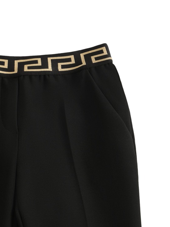 Versace: Pantalon en cady stretch à logo Greca - Noir - kids-girls_1 | Luisa Via Roma