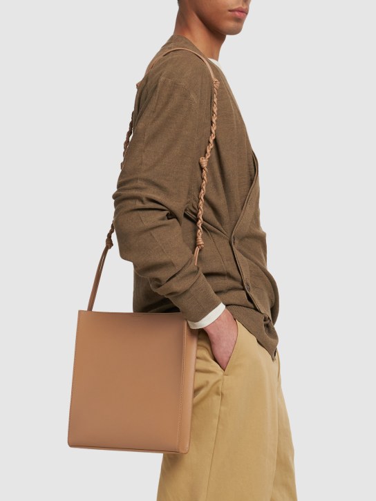 Jil Sander: Medium Tangle leather crossbody bag - Clay - men_1 | Luisa Via Roma