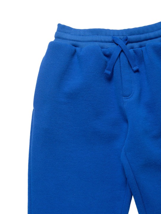 Dolce&Gabbana: Pantaloni in felpa di cotone / logo in metallo - Blu - kids-boys_1 | Luisa Via Roma