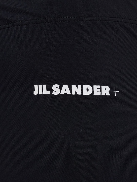 Jil Sander: Leggings de jersey techno con logo - Negro - men_1 | Luisa Via Roma