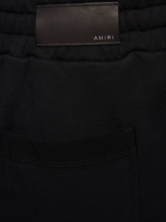 Amiri: Shorts de jersey de algodón con estampado - Negro - men_1 | Luisa Via Roma