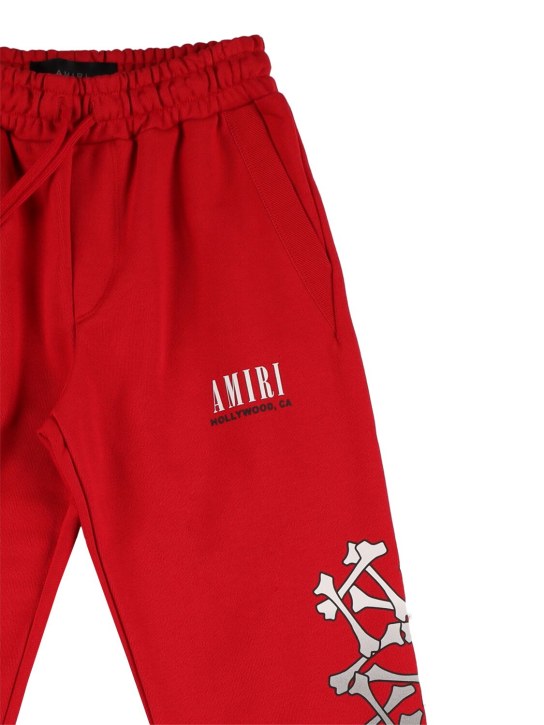 Amiri: Pantaloni in felpa di cotone stampata - Rosso - kids-boys_1 | Luisa Via Roma