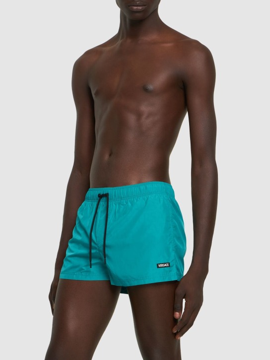 Versace: Bañador shorts de nylon con logo - Glacier Blue - men_1 | Luisa Via Roma