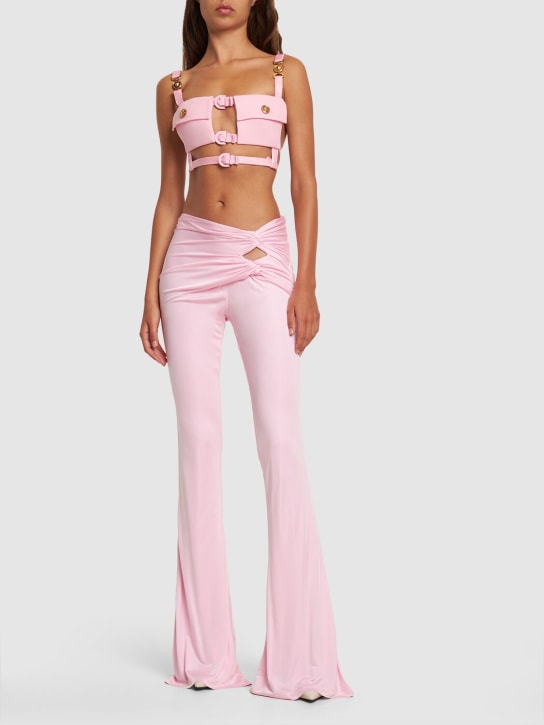Versace: Dua Lipa raped jersey flared pants - Pink - women_1 | Luisa Via Roma