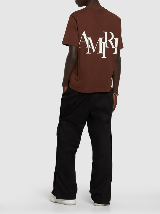 Amiri: Logo print cotton jersey t-shirt - Kahverengi - men_1 | Luisa Via Roma