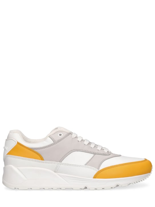 Saint Laurent: Bump皮革运动鞋 - 白色/黄色 - men_0 | Luisa Via Roma