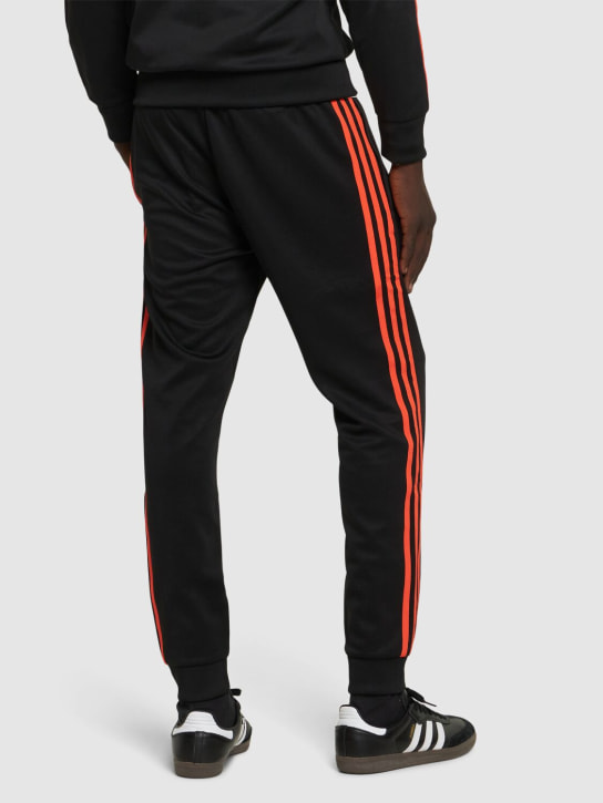 adidas Originals: 3-Stripes track pants - Black/Semoir - men_1 | Luisa Via Roma