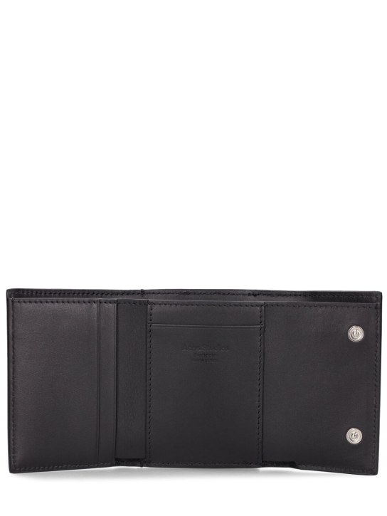 Acne Studios: Leather trifold wallet - Black - men_1 | Luisa Via Roma