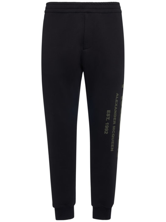 Alexander McQueen: Pantaloni in felpa di cotone con logo - Nero/Khaki - men_0 | Luisa Via Roma
