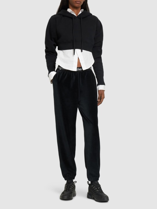 Alexander Wang: Pantalon de sport en coton côtelé stretch à logo - Noir - women_1 | Luisa Via Roma