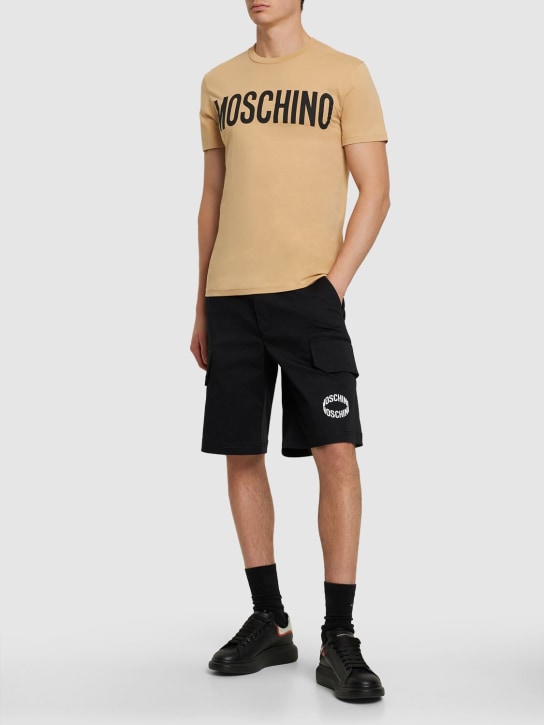 Moschino: Logo print organic cotton jersey t-shirt - Beige - men_1 | Luisa Via Roma