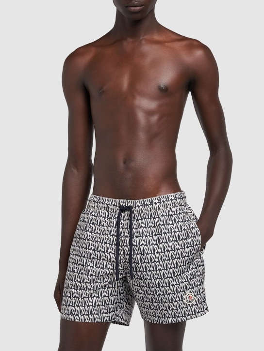 Moncler: Monogram printed tech swim shorts - Mavi - men_1 | Luisa Via Roma