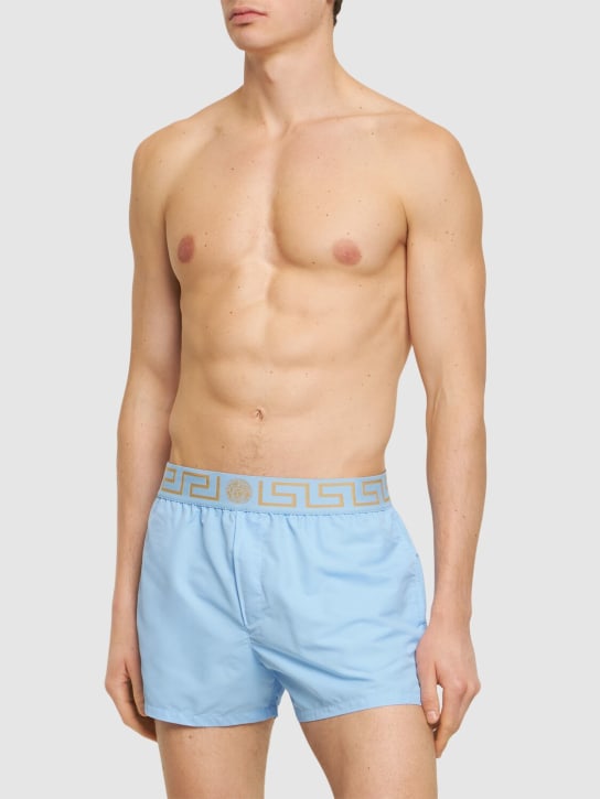 Versace: Monogram waistband tech swim shorts - Gökyüzü Mavisi - men_1 | Luisa Via Roma