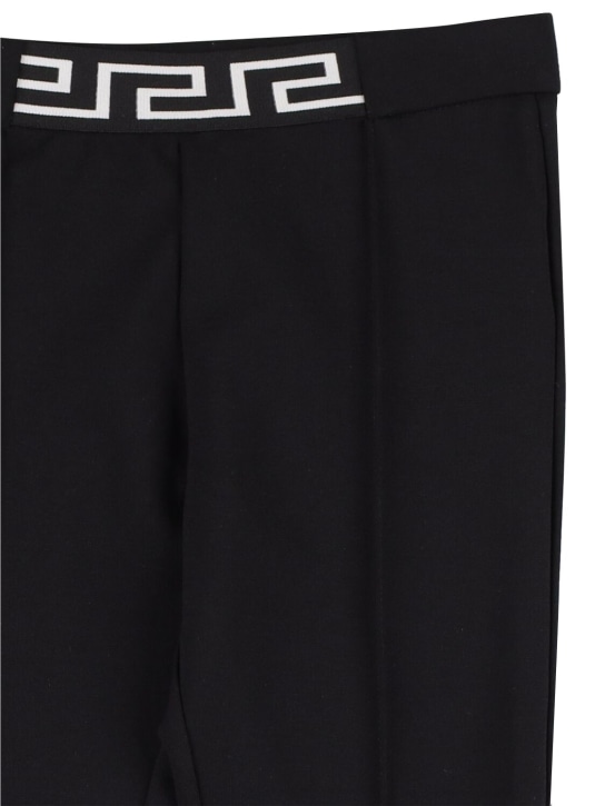 Versace: Pantaloni in jersey interlock - Nero - kids-girls_1 | Luisa Via Roma
