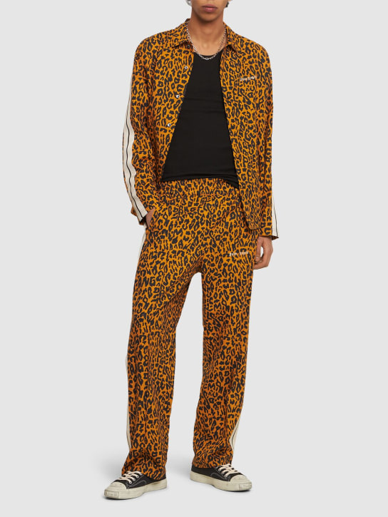 Palm Angels: Cheetah linen blend track pants - Turuncu/Siyah - men_1 | Luisa Via Roma