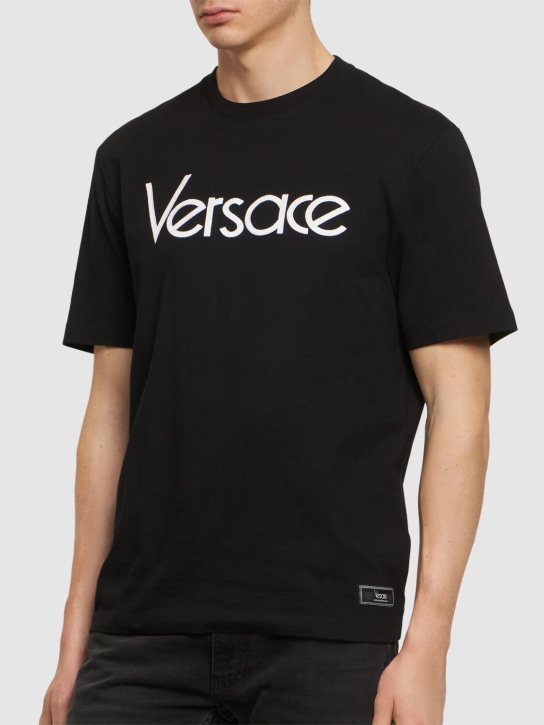 Versace: Logo printed cotton t-shirt - Black - men_2 | Luisa Via Roma