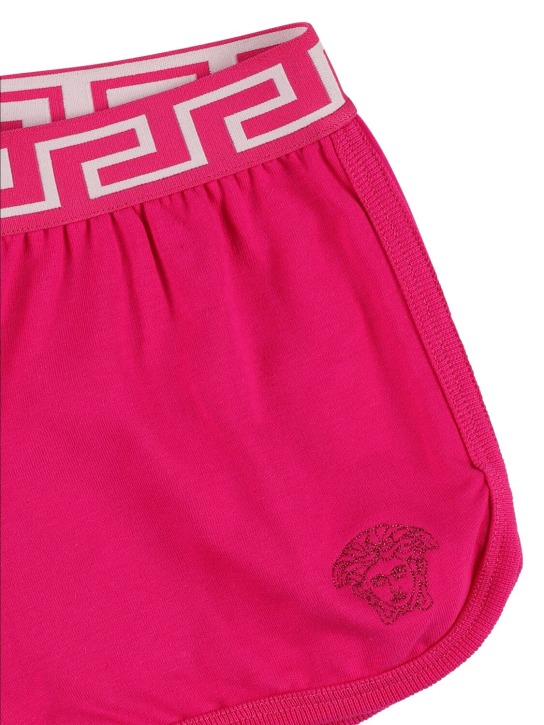 Versace: Shorts in jersey di cotone con ricamo - Fucsia - kids-girls_1 | Luisa Via Roma