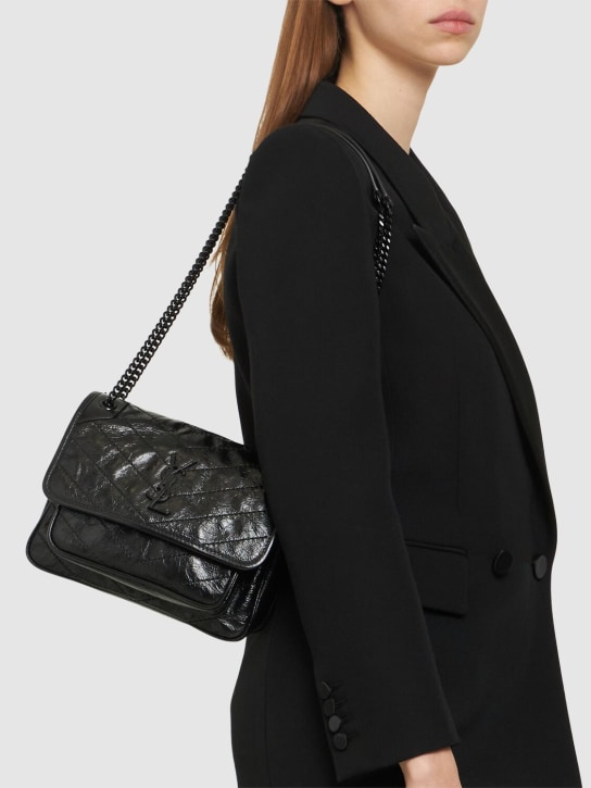 Saint Laurent: Baby Niki vintage leather shoulder bag - Black - women_1 | Luisa Via Roma