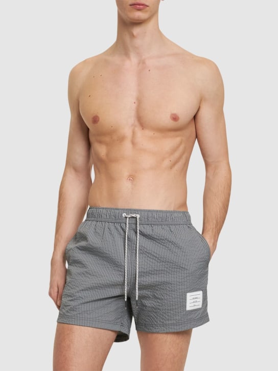 Thom Browne: Seersucker swim shorts - Med Grey - men_1 | Luisa Via Roma