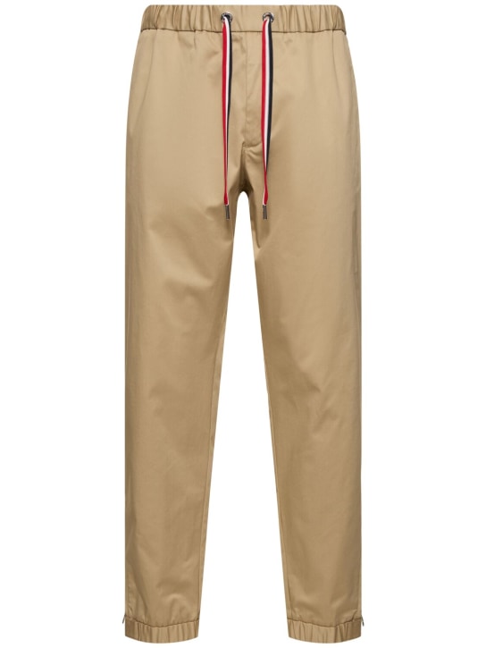 Moncler: Pantalones de gabardina de algodón - Beige - men_0 | Luisa Via Roma