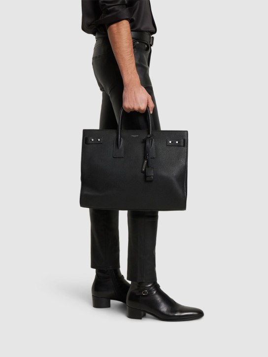 Saint Laurent: Logo slim leather bag - Black - men_1 | Luisa Via Roma