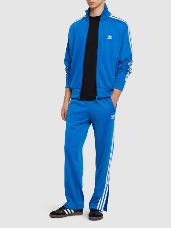 adidas Originals: Pantalon de survêtement en textile tech Firebird - Bleu/Blanc - men_1 | Luisa Via Roma