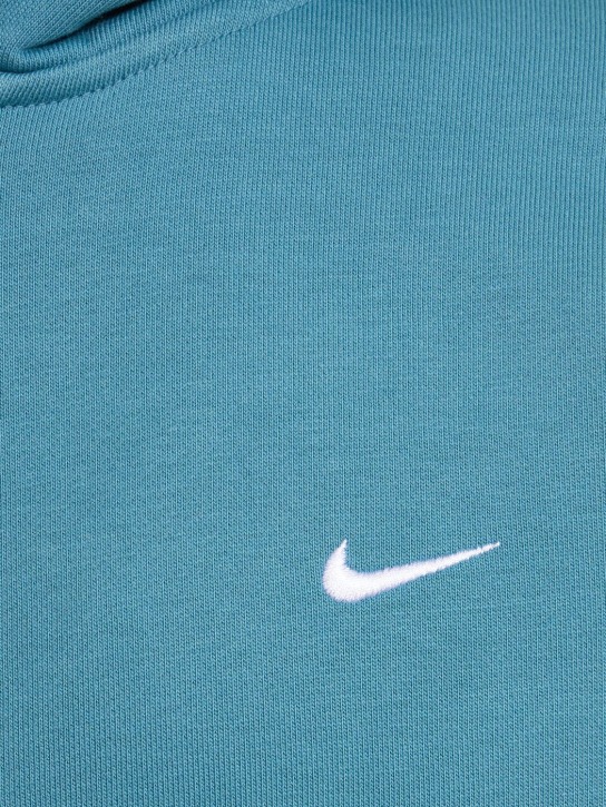 Nike: Sweat zippé en coton mélangé à capuche Solo Swoosh - Noise Aqua - men_1 | Luisa Via Roma