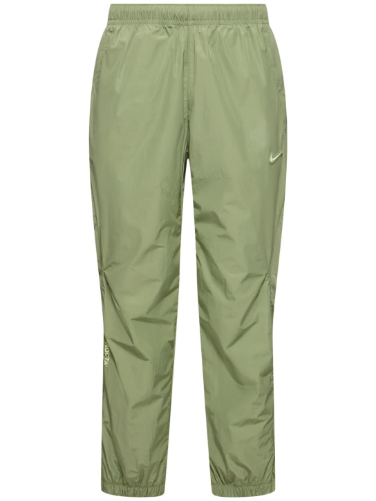 Nike: Pantalones deportivos de techno - Oil Green/Lime - men_0 | Luisa Via Roma