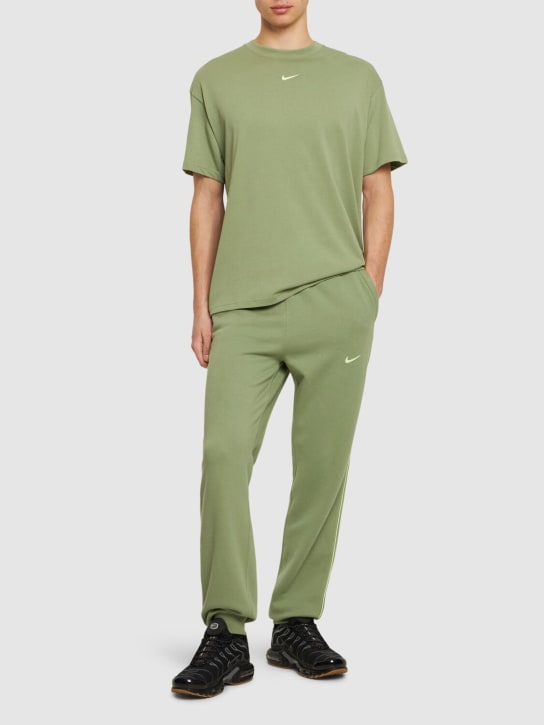 Nike: Pantaloni Nocta in pile - Oli Green/Lime - men_1 | Luisa Via Roma