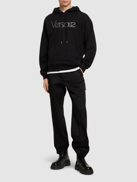 Versace: Cotton jersey logo hoodie - Black - men_1 | Luisa Via Roma