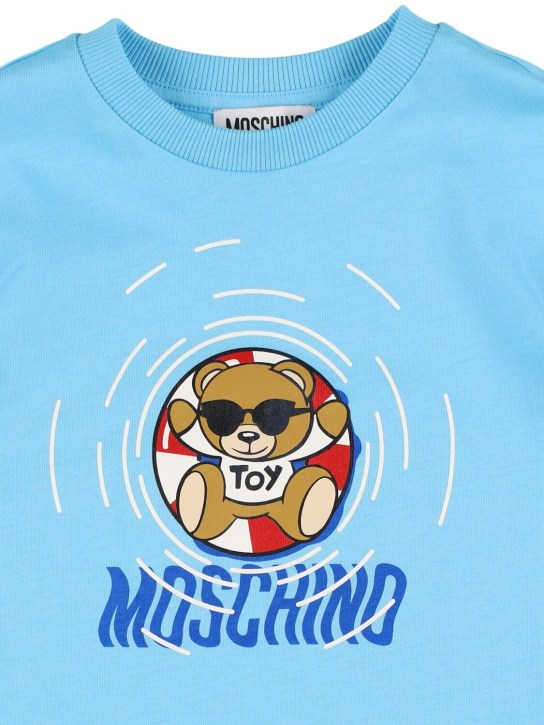 Moschino: T-shirt long en jersey de coton imprimé - Bleu - kids-boys_1 | Luisa Via Roma