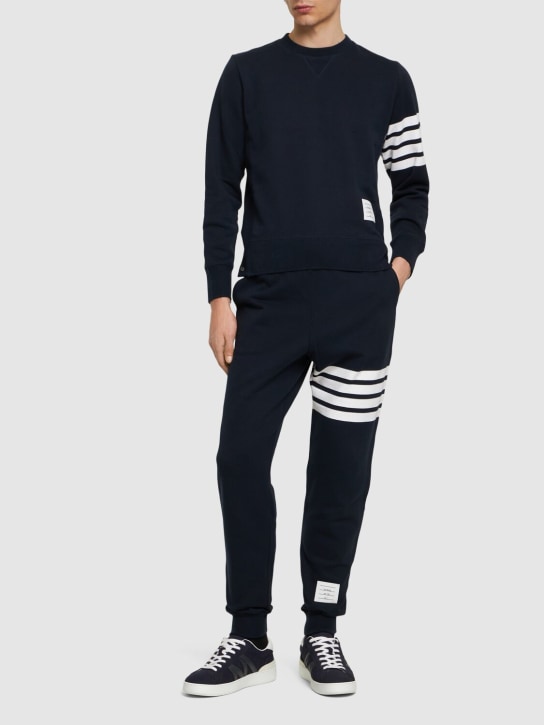Thom Browne: Intarsia stripes cotton sweatpants - Navy - men_1 | Luisa Via Roma
