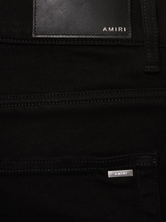 Amiri: 15cm Stack cotton denim jeans - Black - men_3 | Luisa Via Roma